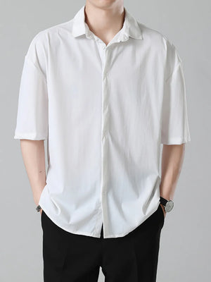 Men's oversized white short-sleeve button-up shirt with a classic collar.