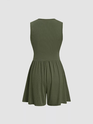 Army green ribbed maternity romper with cinched waist and flared shorts.