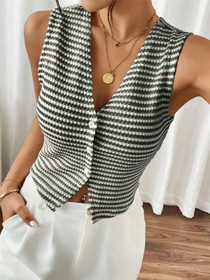 Chic striped knit v-neck tank top with button front, styled with white pants.