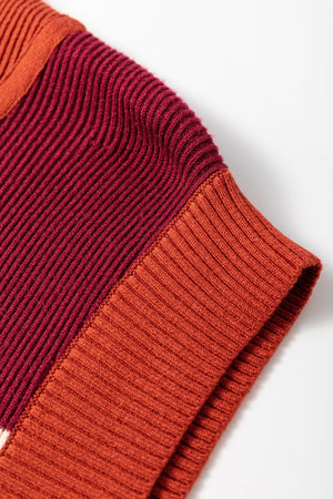 Colorblock ribbed zip-neck mini dress in terracotta and burgundy with ribbed texture and trim.