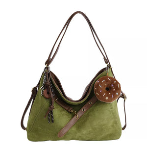 Sage hobo bag with adjustable strap and donut charm accessory