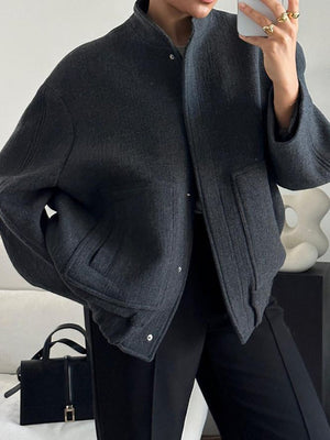 Dark Gray boucle jacket with snap closure, stand collar, and flap pockets.