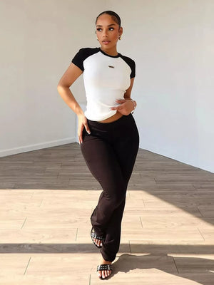 Chic contrast two-piece set with a white short-sleeve tee and black pants.