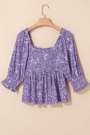 Paisley smocked bodice blouse in lavender with square neck and ruffled cuffs.