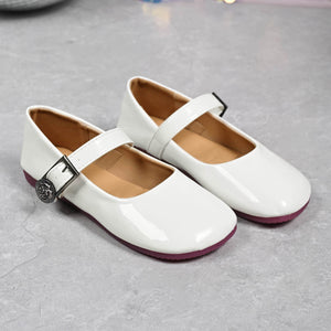 White patent buckle strap Mary Jane loafers with a decorative buckle detail.
