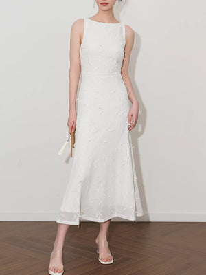 White midi dress with floral applique, boat neck, and a-line cut.