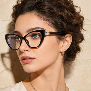 Black cat eye glasses with gold embellishment and clear lenses.