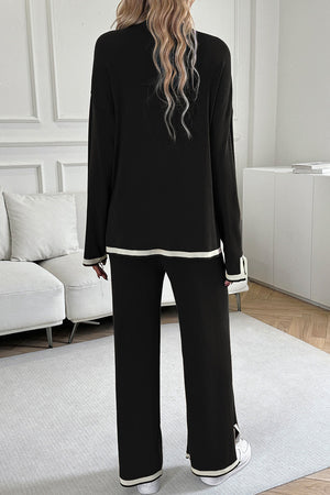 Black ribbed knit loungewear set with cream trim on cuffs and hem.