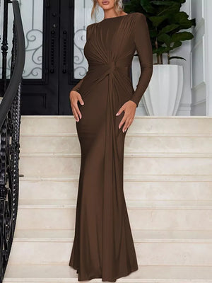 Brown ruched long sleeve maxi dress with knot detail and boat neckline.