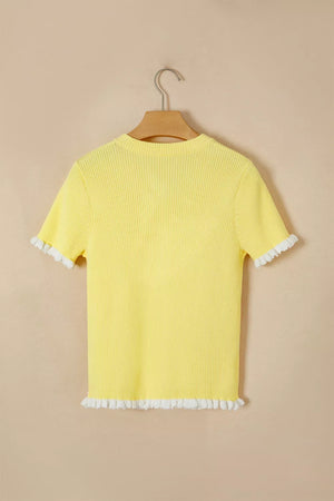 Yellow acrylic short sleeve cardigan with white frilled trim on sleeves and hem.