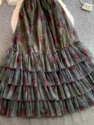 Romantic floral mesh maxi dress in Army Green with tiered ruffles and a sheer overlay.