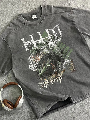 Acid wash graphic tee in dark gray with "The Drip" text and distressed artwork.