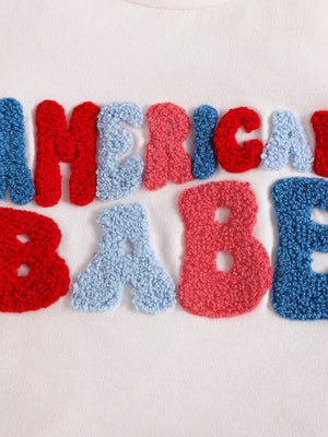 Patriotic toddler two-piece set with chenille letters spelling "AMERICA BABY" in red, white, and blue.