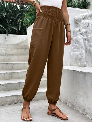 Brown relaxed-fit trousers with smocked waistline and cargo pocket detail