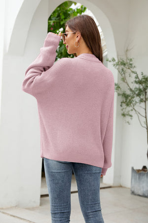 Waffle knit oversized button-front cardigan in carnation pink with a relaxed fit and dropped shoulders.