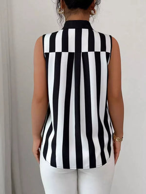 Sleeveless collared shirt in black and white stripes with button detail.