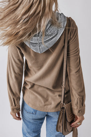 Corduroy shirt jacket in mocha with contrast gray hood, button front, and long sleeves.