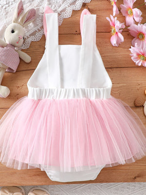 Baby white one-piece with pink tulle skirt and bunny ears on straps.