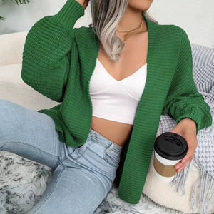 Green chunky knit dolman sleeve cardigan with ribbed texture and balloon sleeves.