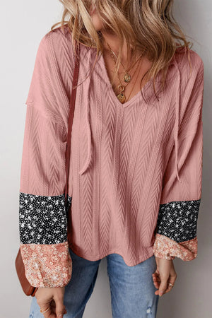 Dusty Pink textured sleeve henley blouse with mixed floral print cuffs and drawstring V-neck.