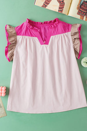 Blush pink and light blue colorblock blouse with ruffle yoke and flutter sleeves.