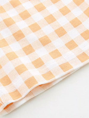 Toddler boys' cotton tee and shorts set in orange and white gingham pattern.