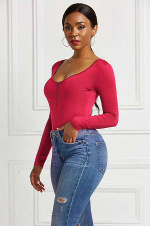 Scarlet long sleeve bodysuit with plunge neckline and front zip detail.