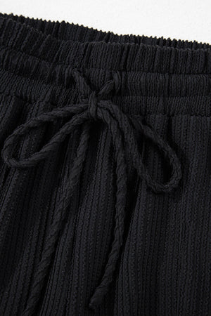 Black textured ribbed lounge set shorts with drawstring waist
