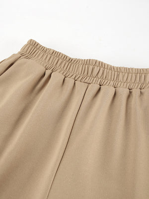 Camel quarter zip top and pants set with elastic waistband detail.
