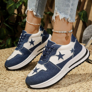 Blue and white denim sneakers with star embellishments and a chunky sole.
