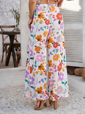 Wide-leg trousers in multicolor floral print with drawstring waist.