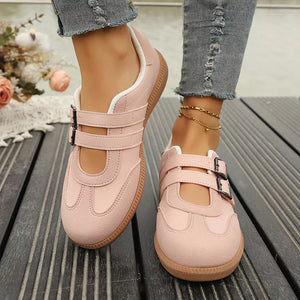 Pink buckle strap Mary Jane inspired sneakers with suede accents and gum soles.