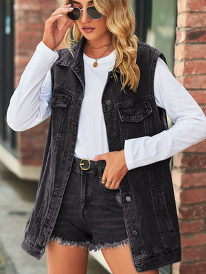 Longline black denim vest with utility pockets and collared neckline.