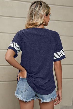 Raglan sleeve tee in dark blue with white varsity stripes on sleeves.