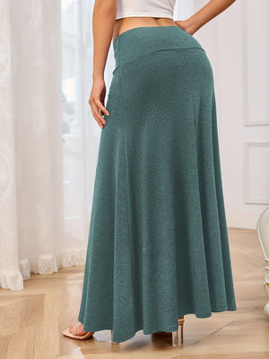 Flowing jersey maxi skirt in teal with a wide waistband and A-line cut.