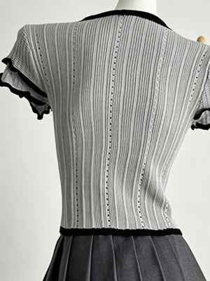 Gray ribbed maternity t-shirt with black frill collar and sleeve details.