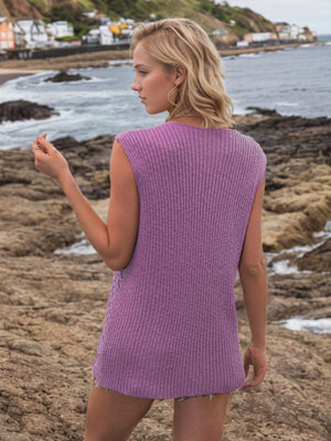 Lilac openwork button-down knit vest with ribbed texture and open sides.