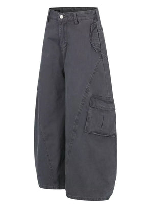 Grey wide-leg cargo pants with prominent pocket details and contemporary cut.