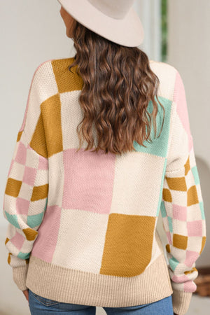 Colorblock checkerboard knit sweater in cream, blush pink, mint green, and mustard yellow.