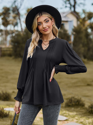 Black long sleeve blouse with pleated yoke and shirred cuffs