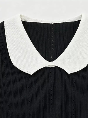 Black maternity t-shirt with white frill collar and ribbed texture.