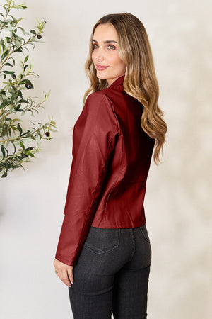 Biker jacket in Wine faux leather with a stand-up collar and long sleeves.