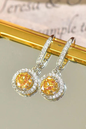 Golden halo moissanite drop earrings with yellow center stones and white diamond accents.
