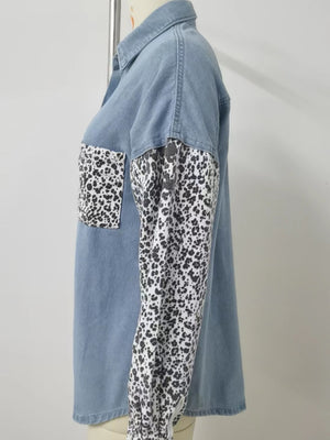 Denim shirt with leopard print sleeves and chest pocket.