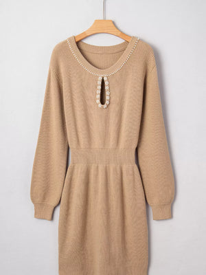 Camel ribbed knit sweater dress with pearl-adorned keyhole neckline and cinched waist.