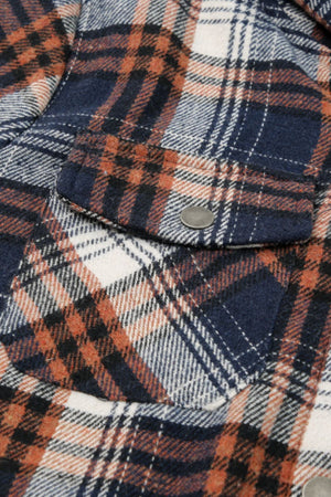 Sherpa-lined plaid overshirt jacket with button flap pockets in navy, tangerine, and white plaid.