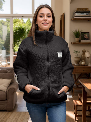 Black textured sherpa zip-up jacket with stand collar and patch detail