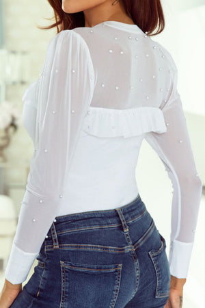 White mesh bodysuit with pearl embellishments and ruffled yoke detail.
