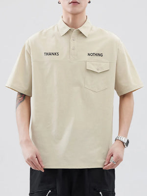 Apricot polo shirt with button detail, chest pocket, and "THANKS NOTHING" text.