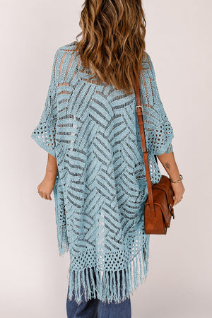 Light blue open knit chevron fringe cardigan with short sleeves and a boho vibe.